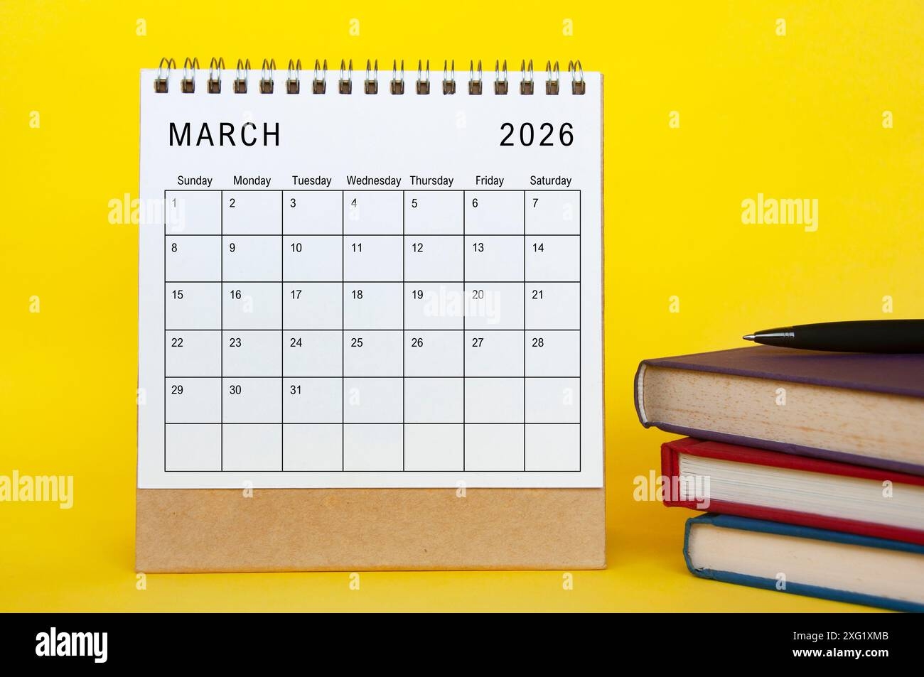 March 2026 Calendar With Yellow Cover Background And Books New Month And Calendar Concept Stock Photo Alamy